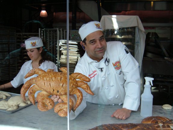 Boudin_Bakery,_Fisherman's_Wharf_baker_showing_off_crab_1